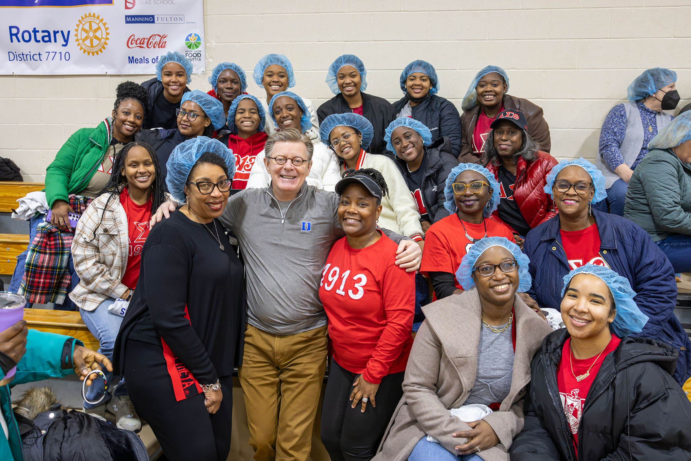 President Vincent Price with Duke volunteers at the Rotary Club event.