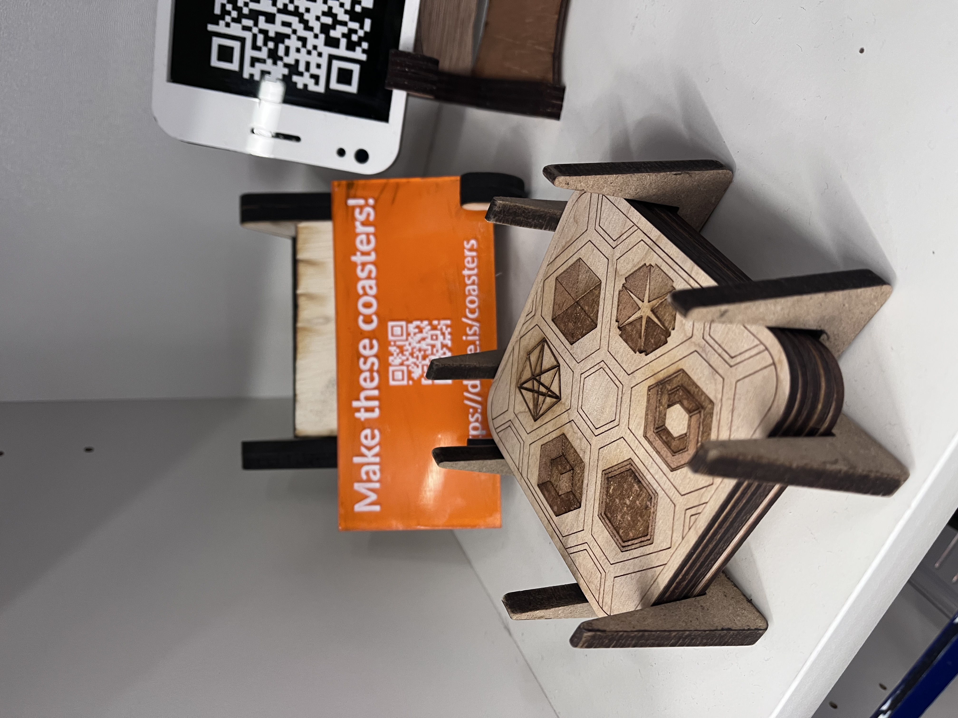 A coasters stand sits on a desk nook.