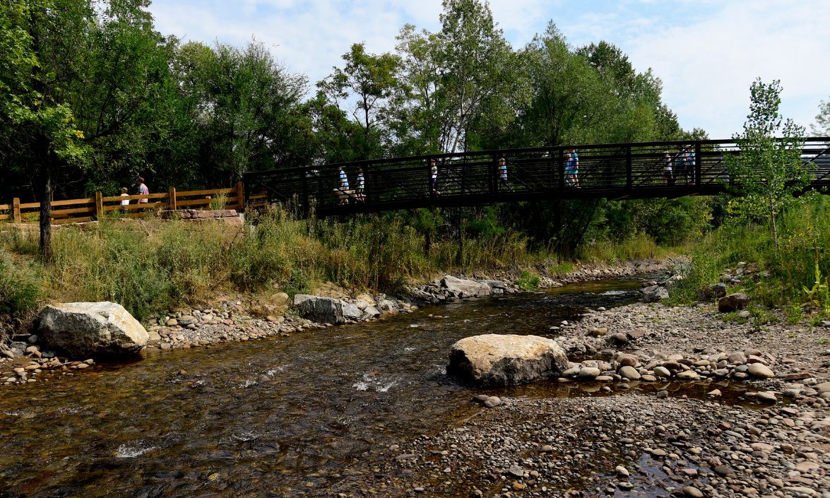 A bridge over a small park river.