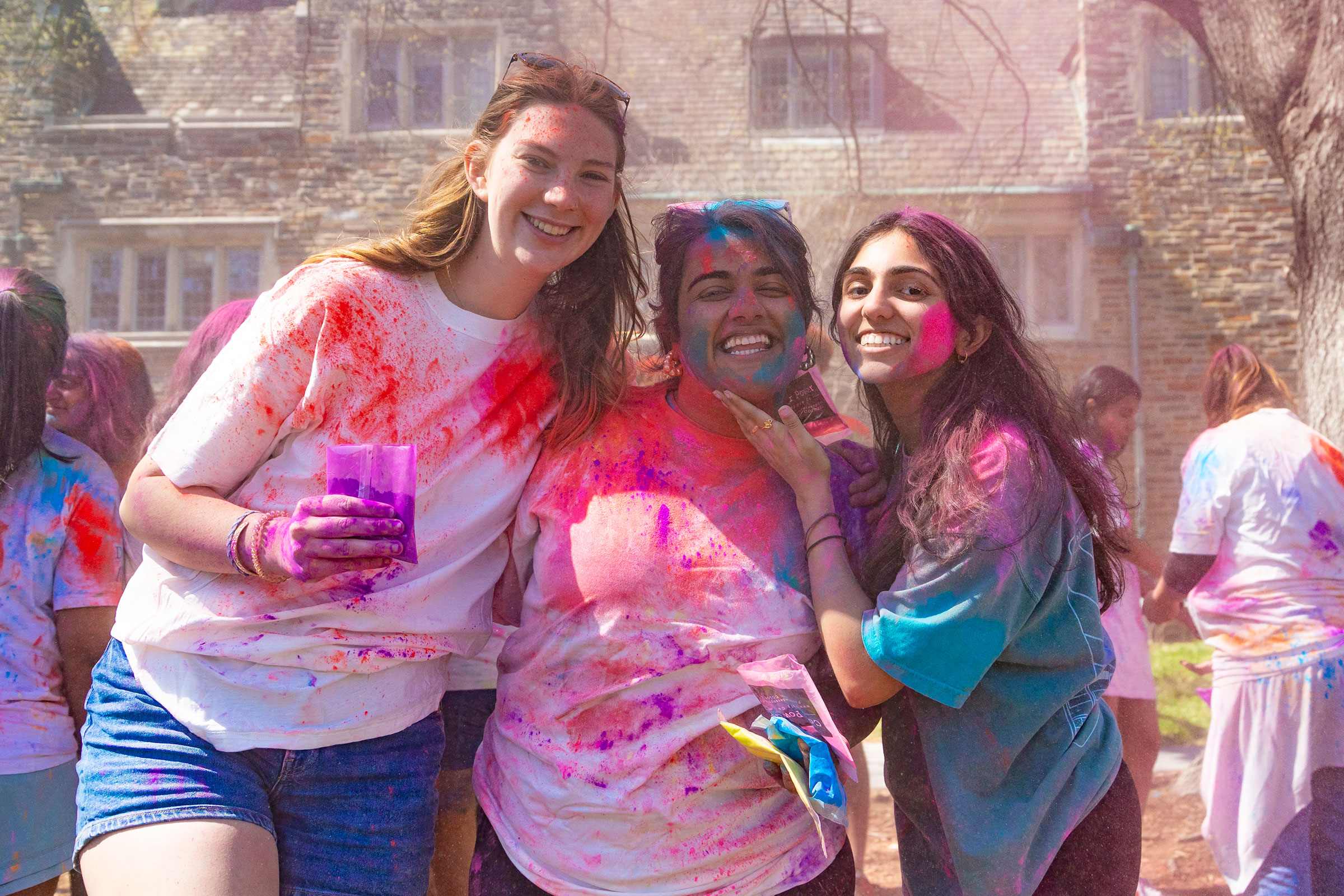 three women smiling during the celebration
