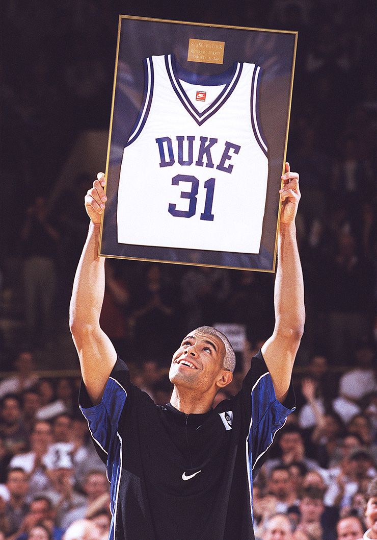Shane Battier holds his retired No. 31 Duke jersey