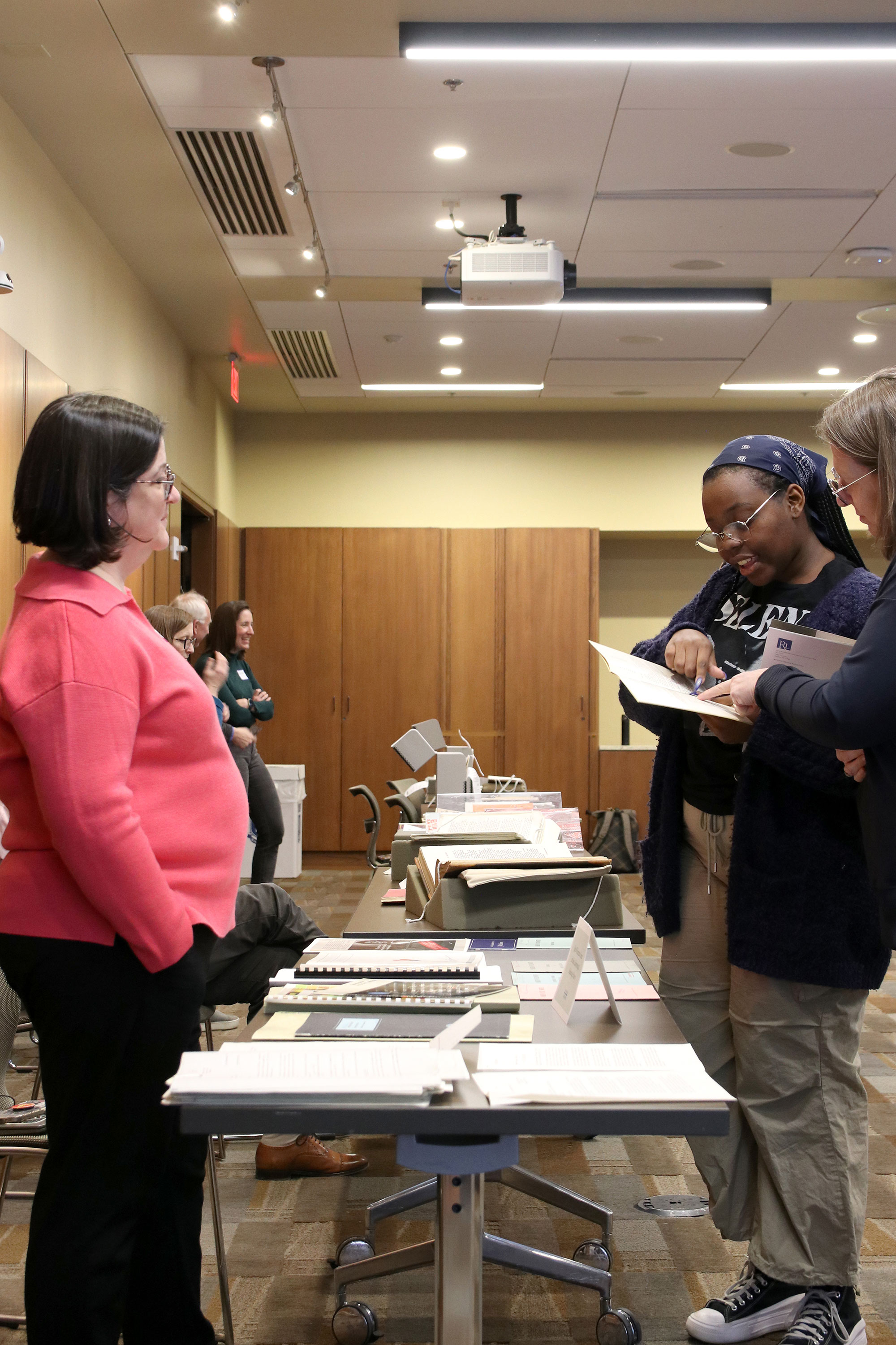 Librarians share information about the materials with visitors

