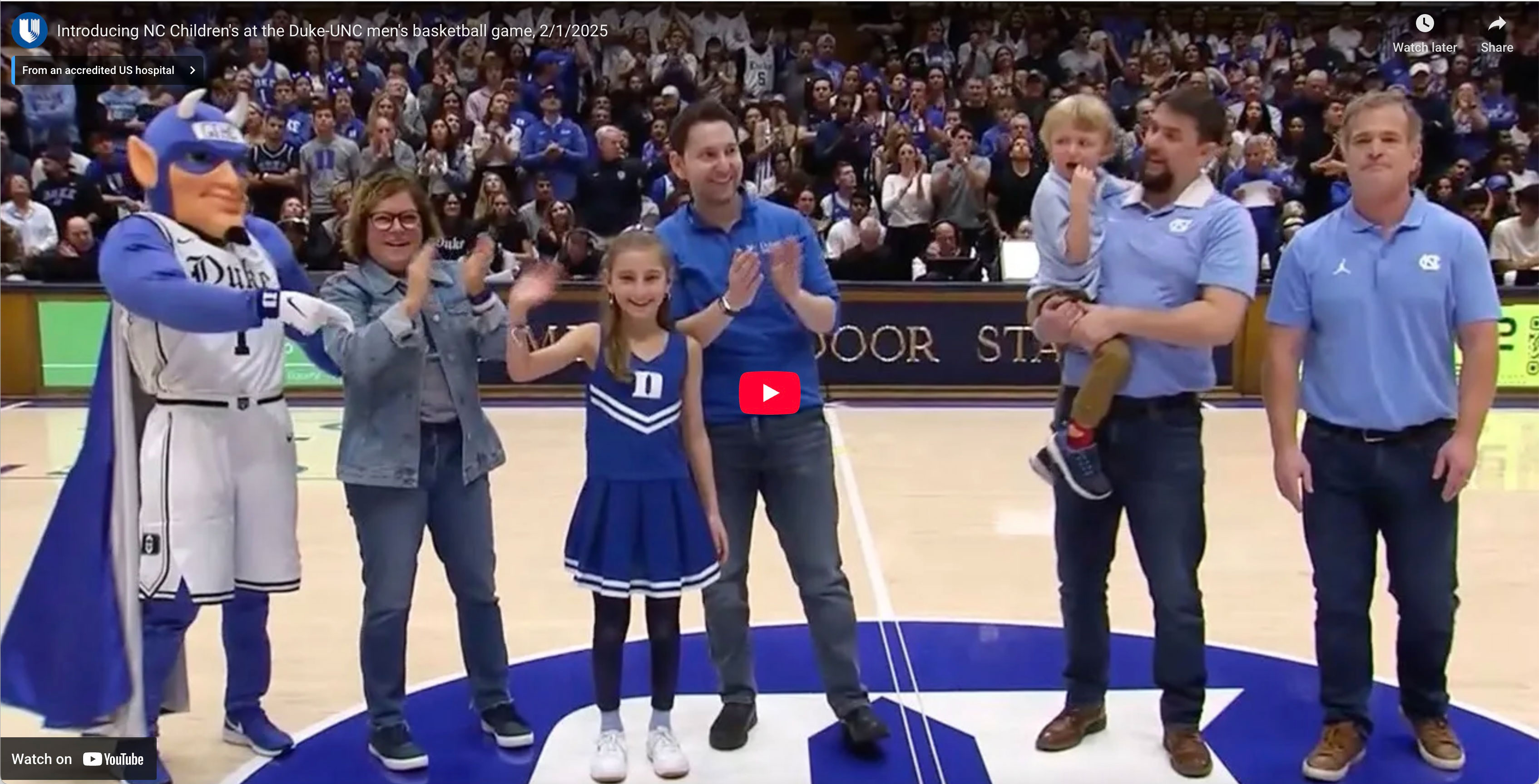 patients and Duke fans celebrate announcement of children's hospital at a Duke basketball game