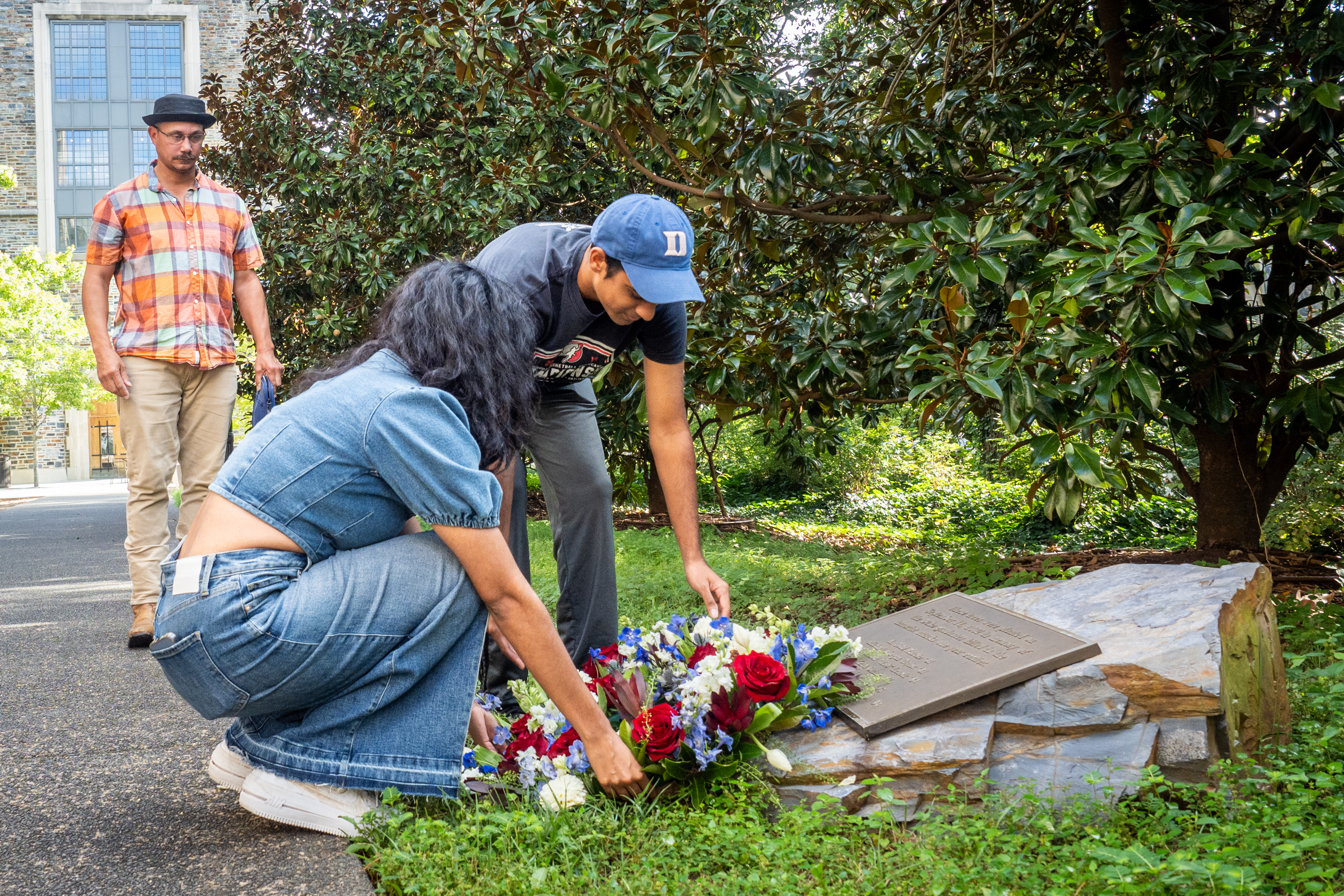 Tara Singh, President of Keohane Quad Council and class of 2026 and Ranjan Jindal, Vice-President of Keohane Quad Council and class of 2026, lay a wreath on the plaque near the grove of six trees planted