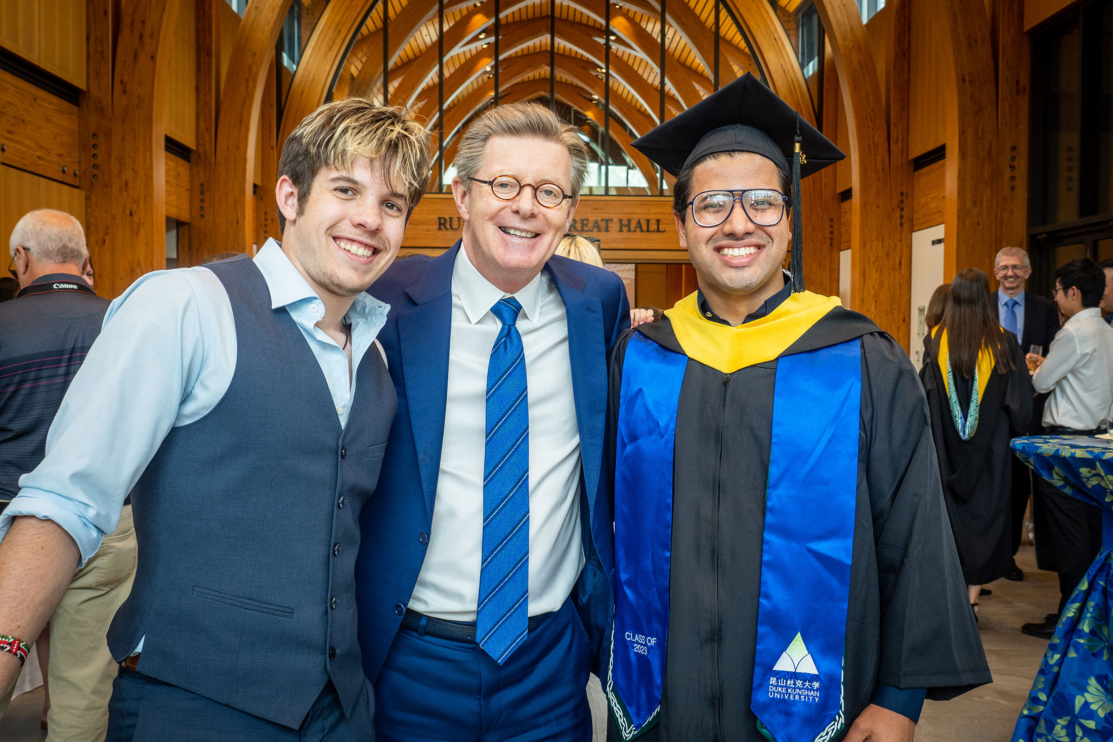 Duke President Vincent Price congratulates new DKU graduates following Thursday's ceremony. Photo by Bill Snead