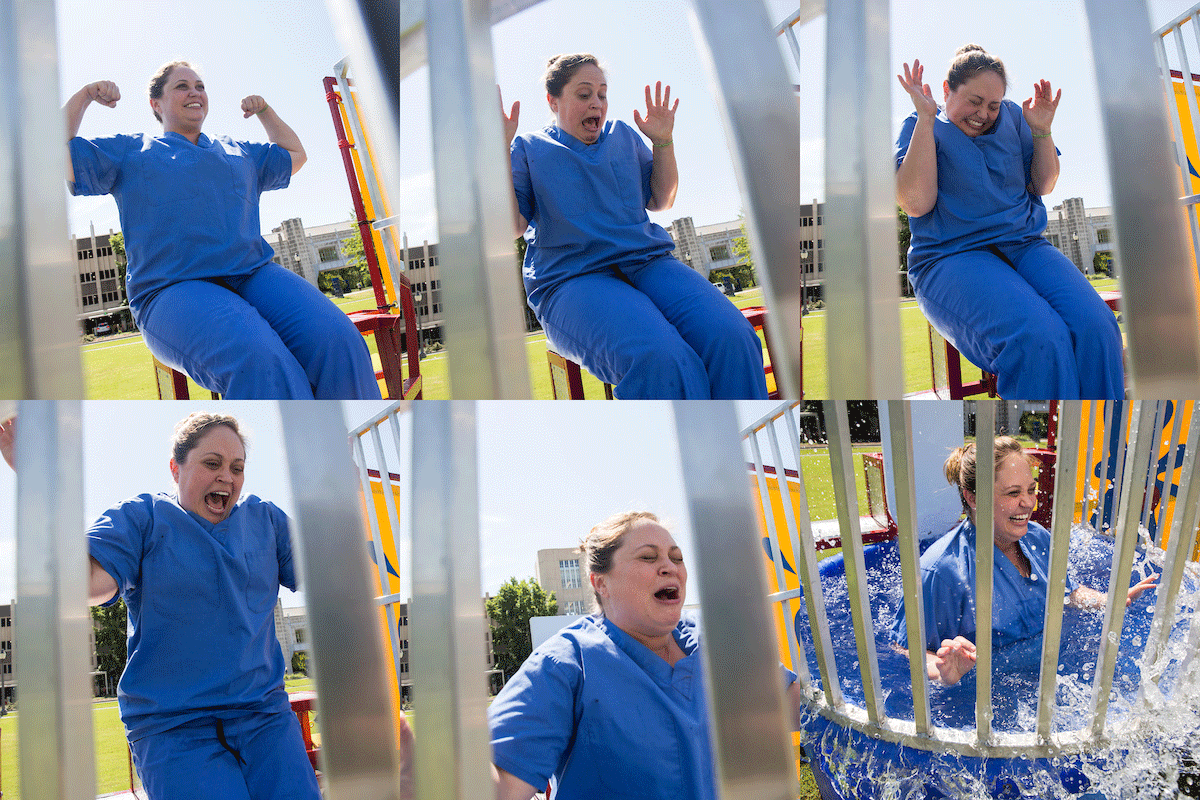 Snapshot of a dunking: Dr. Rebecca Previs goes down into the water during the Dunk-A-Doc fund-raising event at Duke Cancer Center on May 16. Photo by Shawn Rocco