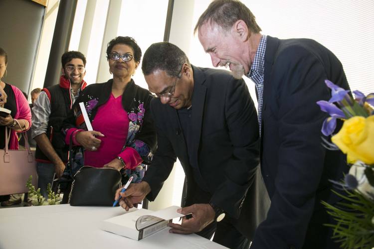 Eduardo Bonilla-Silva signs a copy of “White Logic, White Methods: Racism and Methodology