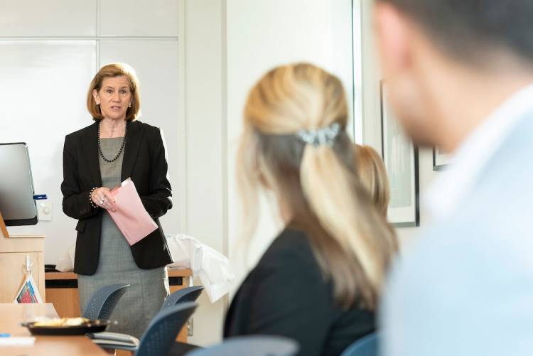 Dr. Mary Klotman, dean of the School of Medicine and vice chancellor for health affairs, discusses medical education with the class.