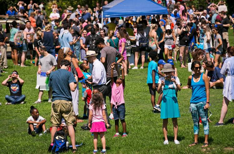 Crowds gather on the south lawn of the Sarah P. Duke Gardens to watch the eclipse. Photos by Megan Mendenhall