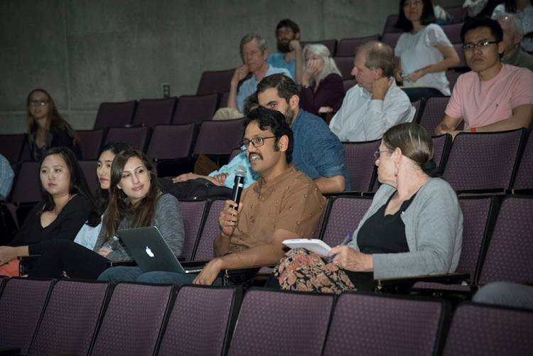 Audience members ask questions of Michael Tomasello following his presentation. Photo by Les Todd