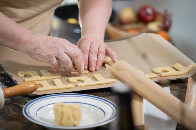 Dr. Ingrid Daubechies, James B. Duke Distinguished Professor of Mathematics and Electrical and Computer Engineering, bakes Pi cookies in anticipation of Pi Day.