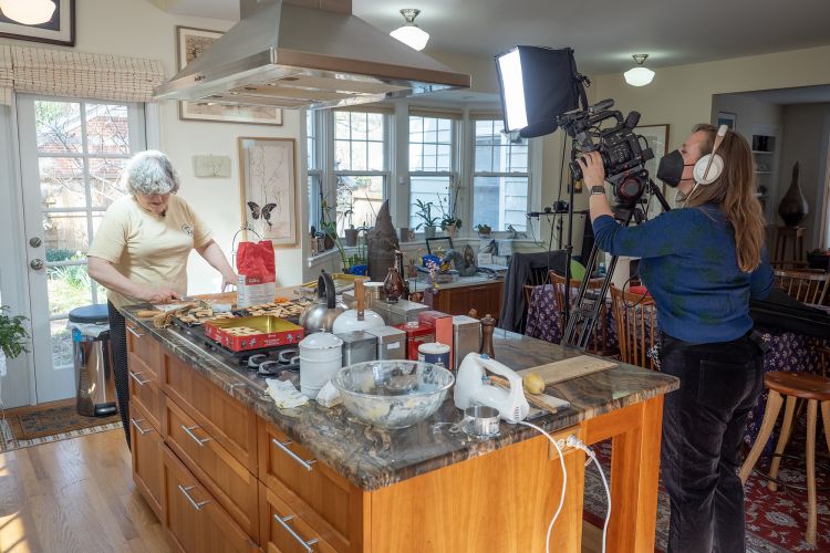Dr. Ingrid Daubechies, James B. Duke Distinguished Professor of Mathematics and Electrical and Computer Engineering, bakes Pi cookies in anticipation of Pi Day while Duke Communications films.