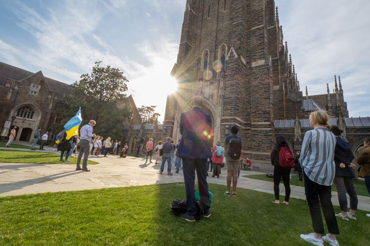 people gather outside Duke Chapel to hear prayers for Ukraine