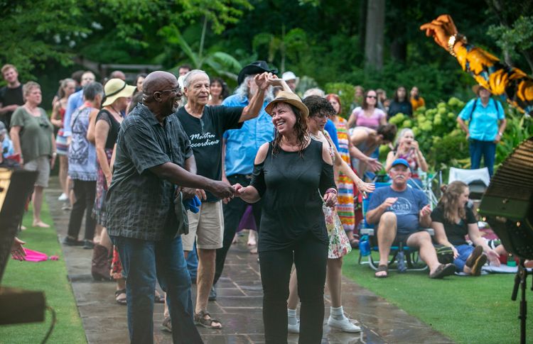 dancing in the rain in Duke Gardens