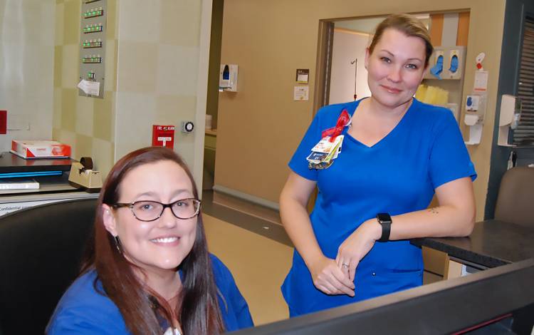 Amy Wright, left, and Amanda Gress, right, are award-winning nurses in Duke Regional Hospital's Critical Care Unit. Photo by Stephen Schramm.