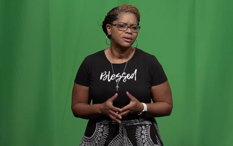 Trina Rodriguez performs her spoken word poem during a recording session with colleague J. Brandon Johnson. Photo courtesy of J. Brandon Johnson.