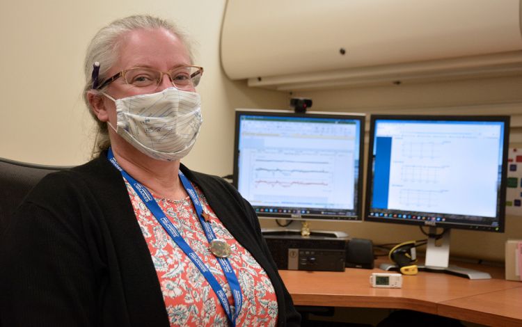Duke University Libraries' Beth Doyle can monitor conditions in library spaces from her computer. Photo by Stephen Schramm. Duke University Libraries' Beth Doyle can monitor conditions in library spaces from her computer. Photo by Stephen Schramm.