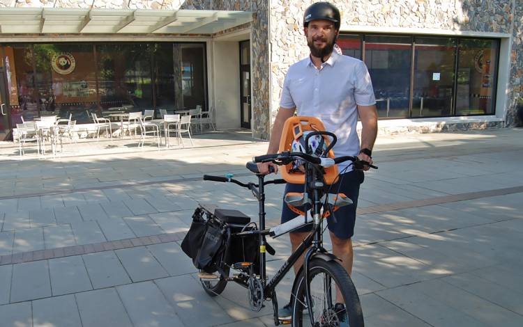 Biomedical engineering scientist David Bradway shows off his bike during Friday's Bicyclist Appreciation Breakfast.