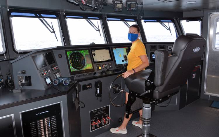 Duke University Marine Lab Marine Technician Tina Thomas pilots the R/V Shearwater during a recent trip. Photo courtesy of Matthew Dawson.