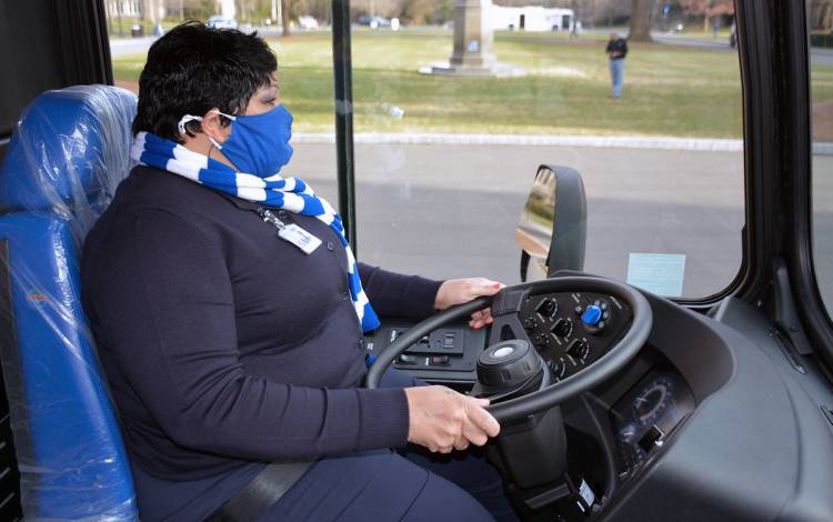 Robin Rawls, transportation supervisor for Duke Parking & Transportation, drives one of the new electric buses on Chapel Drive.