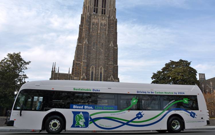 One of the electric buses displays the Sustainable Duke logo.