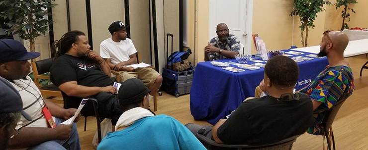 Angelo Moore talks at a men's health conversation organized by the Durham non-profit CAARE. Photo courtesy the Office of Health Equity. 