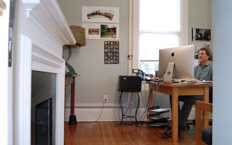 Greg Britz of the Center for Documentary Studies works in his office on the second floor of the Lyndhurst House. Photo by Stephen Schramm.