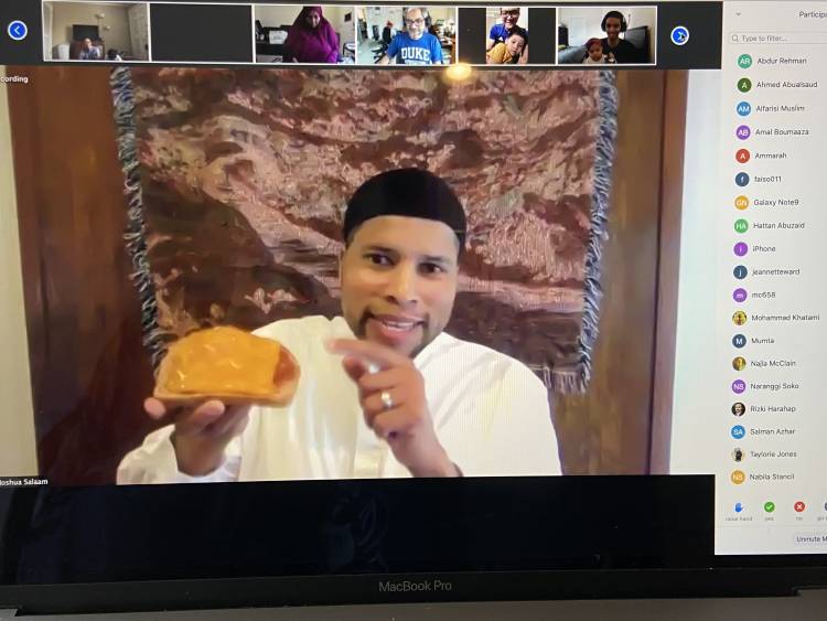 Chaplain  Joshua Salaam sharing food during a Jumuah conducted over Zoom.