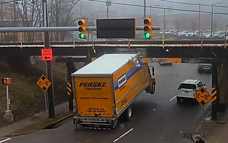 Jurgen Henn's camera captures a Penske truck ramming into a beam that protects the Gregson Street overpass. Photo courtesy of Jurgen Henn.