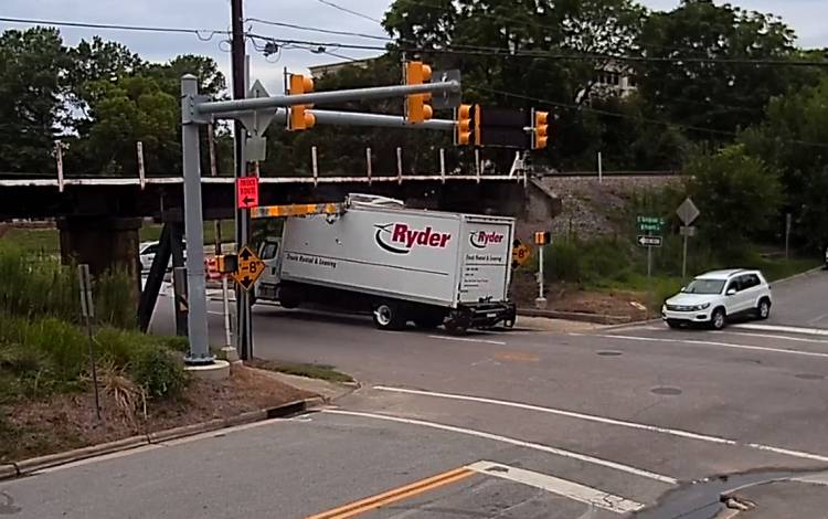 The top of a Ryder truck is shaved off at the Can Opener Bridge. Photo courtesy of Jurgen Henn.
