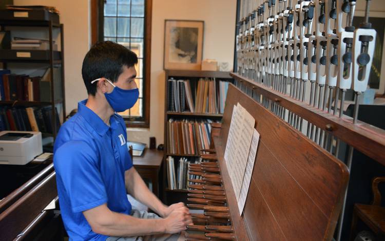 Joseph Fala uses his fist to play the carillon. 