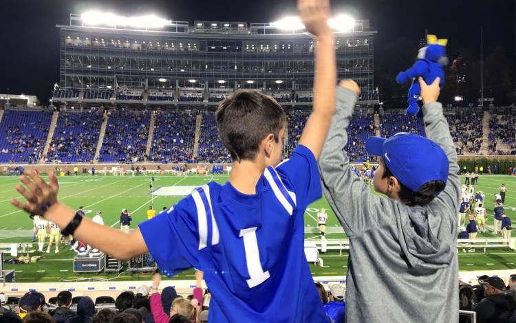 Colin Jee, left, and Kevin Jee cheer on Duke at a game last season. Photo by Lori Jee.