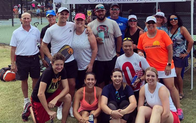Clifford Chu, kneeling, second from right, poses with his teammates after a pickleball tournament. Submitted photo. 