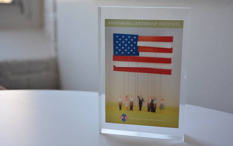 A glass memento holds the sign for the Annenberg Leadership Institute, a program Howes created while working in Washington D.C. Photo by Jonathan Black.