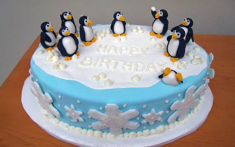 One of Debbie Suggs' first creations for colleagues was a cake decorated with fondant penguins. Photo courtesy of Debbie Suggs.