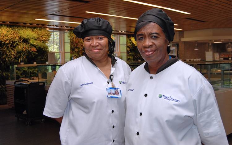 Duke Dining's Julia Anderson and Saundra Norwood try ti lift the spirits of students during the stress of final exams. Photo by Stephen Schramm.