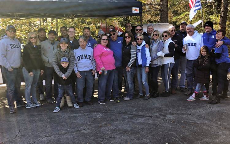 Donna Flamion, second from left, often organizes tailgate parties for Duke football games that draw dozens of guests. Photo courtesy of Donna Flamion.