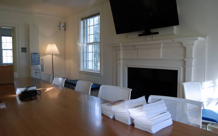 Duke Performances' conference room features the remnants of an old fireplace, a sign of the building's past life as a private home. Photo by Stephen Schramm.