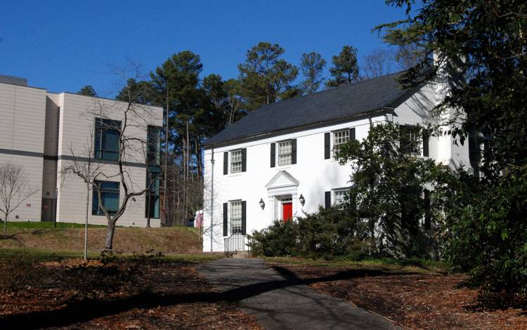 The small white house that holds the Duke Performances office sits on Campus Drive. Photo by Stephen Schramm.