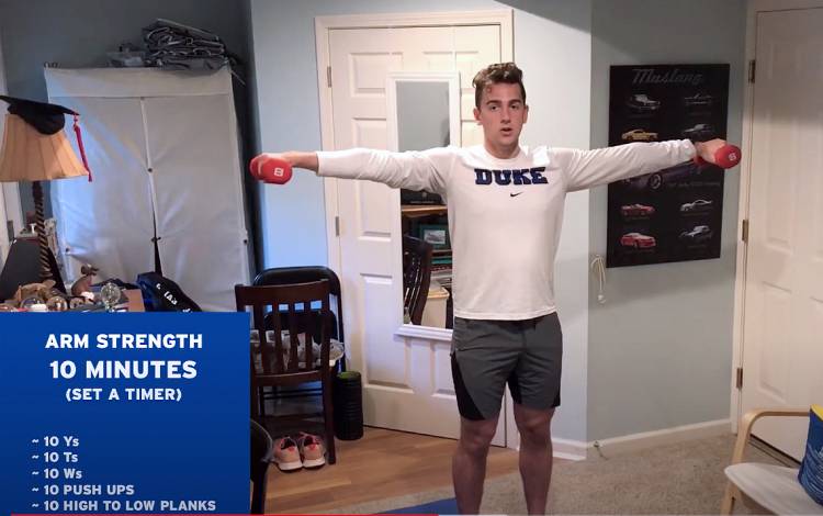 Macjilton Lewis, a digital media assistant for Duke Athletics and coach for Duke Recreation & Physical Education's swim program, leads an at-home workout. Photo courtesy of Duke Rec & PE.