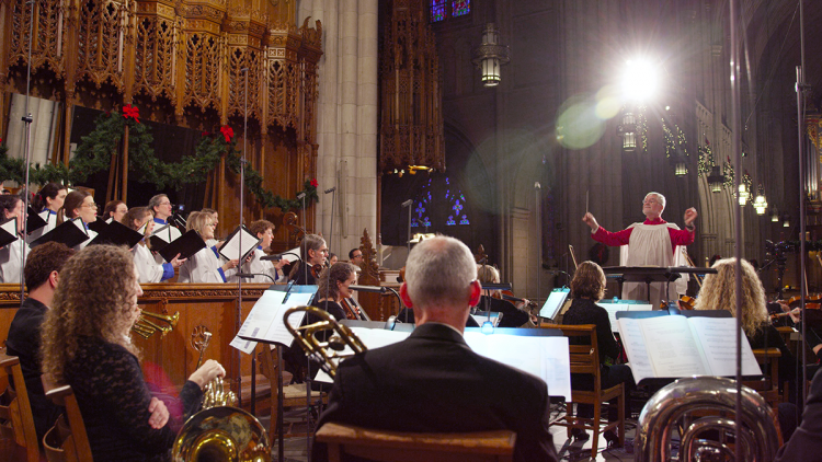 Philip Cave, associate conductor for Chapel Music, leads a choral performance.