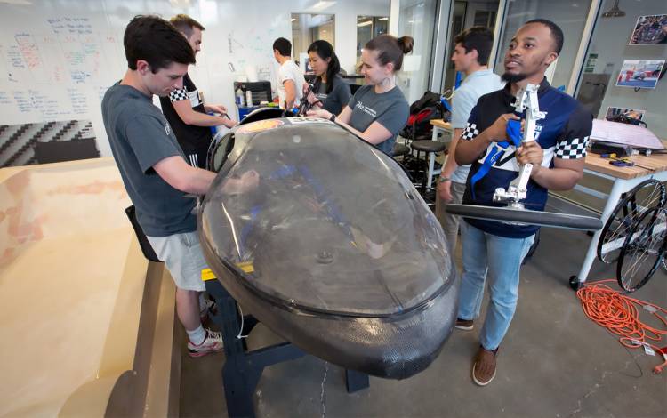 Students working on an electric vehicle.