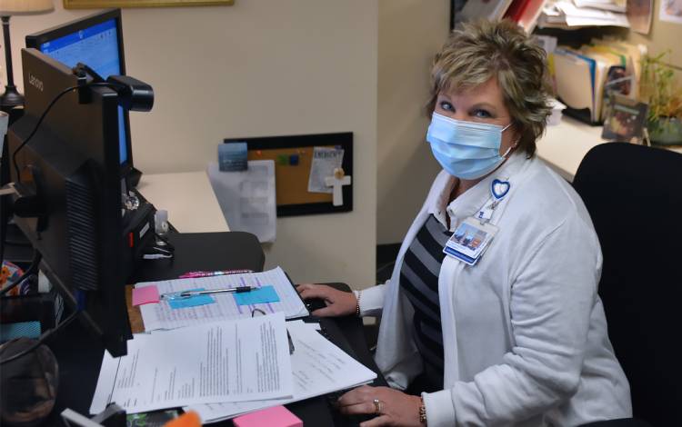 Elizabeth Norwood works full-time from her office in the Davison Building. Photo by Jonathan Black.