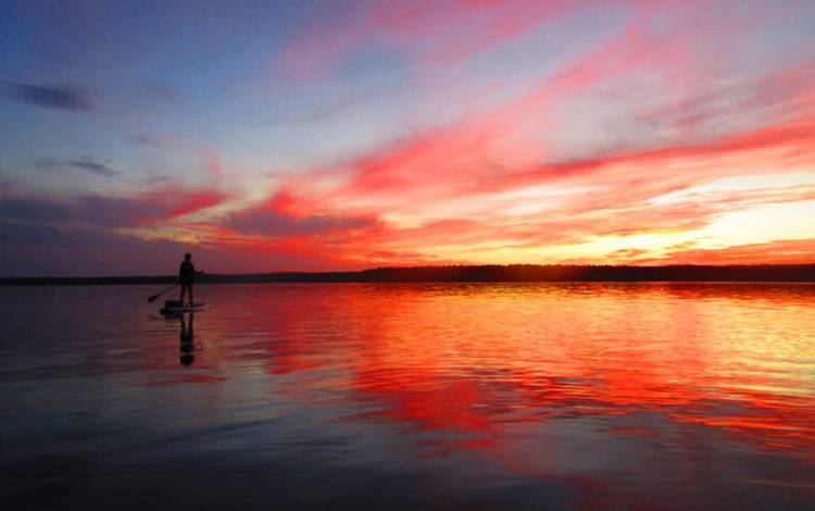 On her new paddle board, Duke Primary Care Morrisville's Melissa Fike has been able to enjoy sunsets such as these. Photo courtesy of Melissa Fike.