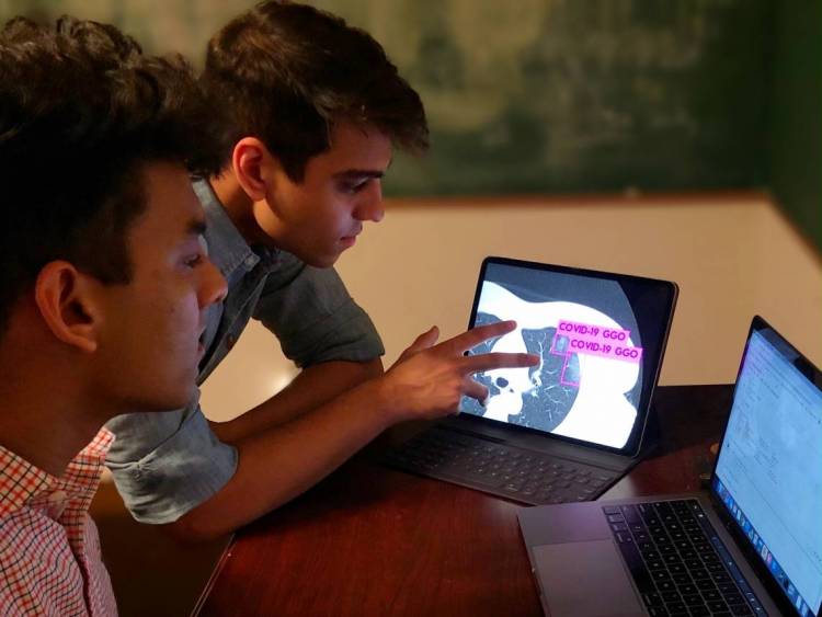 Duke students Anmol Warman ’22 and Pranav Warman ’20 have trained a computer to spot the telltale signs of COVID-19 in lung scans and rule out other infections that look similar to the human eye.