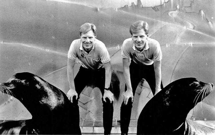 Greg Dye, right, and his brother Craig, pose with a seal during their time working as trainers at SeaWorld. Photo courtesy of Greg Dye.