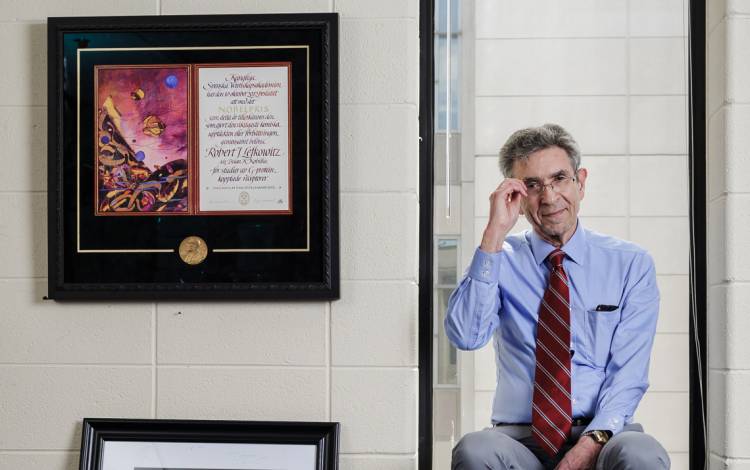 One of Robert Lefkowitz’ three replica Nobel Prize medallions hangs in a frame on the wall of his office. 