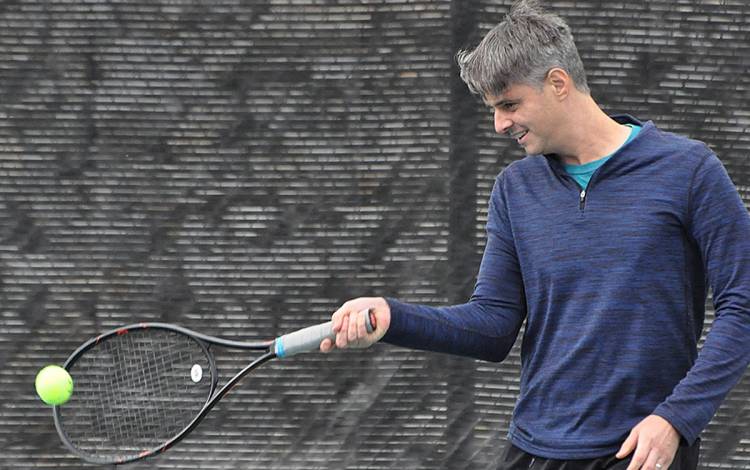 Ivan Ross tries to minimize his contact with high-touch surfaces while playing tennis. Photo courtesy of Ivan Ross.