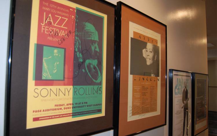 Posters on the wall of the Mary Lou Williams Center provide a glimpse into some of the jazz stars who have played on campus. Photo by Stephen Schramm.