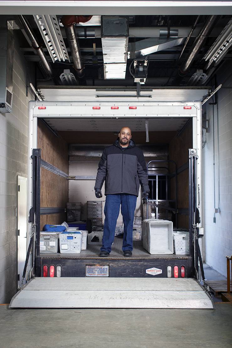 Senior Mail Clerk Joe Rhodes makes multiple trips each day taking books too and from campus. Photo by Alex Boerner.